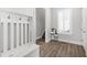 Bright foyer featuring light wood floors, a hall tree, and a window with shutters at 200 Gravel Brook Ct, Cary, NC 27519