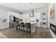 Bright kitchen with a stainless steel appliances, an island with barstool seating, and sleek pendant lighting at 200 Gravel Brook Ct, Cary, NC 27519