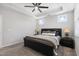 The main bedroom features a tray ceiling with fan, carpeted floor, and ensuite bathroom access at 200 Gravel Brook Ct, Cary, NC 27519