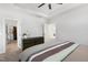 The main bedroom features a tray ceiling with fan, carpeted floor, and ensuite bathroom access at 200 Gravel Brook Ct, Cary, NC 27519