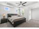 The main bedroom features a tray ceiling with fan, carpeted floor, and ensuite bathroom access at 200 Gravel Brook Ct, Cary, NC 27519