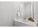 Clean powder room featuring bright white vanity, and a modern mirror at 200 Gravel Brook Ct, Cary, NC 27519