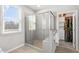 Bathroom shower is tiled with glass doors and a window at 200 Gravel Brook Ct, Cary, NC 27519
