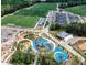Aerial view of the community featuring soccer fields, parking lots, playground, and a gazebo in the background at 2114 Frissell Ave, Apex, NC 27502