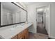 Bathroom with tile floor, vanity, sink, and view to glass shower and living room at 2114 Frissell Ave, Apex, NC 27502