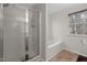 Bathroom featuring glass shower, soaking tub, tile flooring, and window at 2114 Frissell Ave, Apex, NC 27502