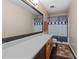 Bathroom featuring a large mirror, vanity with wooden cabinets, and shower-tub combination is clean and modern at 2114 Frissell Ave, Apex, NC 27502