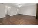 Bright bedroom with closet and adjoining door, ceiling fan, hardwood flooring, neutral paint at 2114 Frissell Ave, Apex, NC 27502