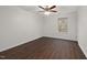 Clean, empty bedroom with ceiling fan, hardwood floors, and one window at 2114 Frissell Ave, Apex, NC 27502
