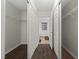 Walk-in closet, hardwood floors with wire racks and a bathroom view at 2114 Frissell Ave, Apex, NC 27502