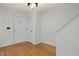 Bright entryway with hardwood floors, fresh paint, and white doors at 2114 Frissell Ave, Apex, NC 27502
