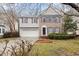 Charming two-story home featuring a two-car garage and manicured lawn at 2114 Frissell Ave, Apex, NC 27502
