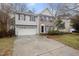 Two-story home with a two-car garage, driveway and landscaped front yard at 2114 Frissell Ave, Apex, NC 27502