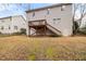 View of the back exterior of home with a deck and stairs at 2114 Frissell Ave, Apex, NC 27502