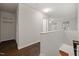 Upstairs hallway with hardwood floors, closet and doors showcases the home's simple modern design at 2114 Frissell Ave, Apex, NC 27502