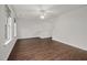 Spacious living room with hardwood floors and a ceiling fan provides a great place to relax and entertain at 2114 Frissell Ave, Apex, NC 27502