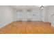 Bright living area featuring hardwood floors, neutrally painted walls, and two large windows at 2114 Frissell Ave, Apex, NC 27502