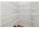 Walk-in pantry with multiple wire shelves provides ample storage and organization at 2114 Frissell Ave, Apex, NC 27502