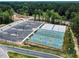 Aerial shot of the community's pickleball and basketball courts and a large parking area at 2114 Frissell Ave, Apex, NC 27502
