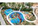 Colorful playground with slides, climbing structures, and soft ground cover for enjoyment at 2114 Frissell Ave, Apex, NC 27502