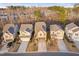 Aerial view of three homes on a street with mature trees in the background at 2117 Mckenzie Ridge Lane Ln, Apex, NC 27502