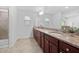 Bathroom with double sinks and a large mirror at 2117 Mckenzie Ridge Lane Ln, Apex, NC 27502