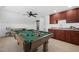 A furnished bonus room featuring a pool table, wet bar, and a seating area at 2117 Mckenzie Ridge Lane Ln, Apex, NC 27502
