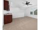 A large bonus room featuring a wet bar, neutral paint, and carpet floors at 2117 Mckenzie Ridge Lane Ln, Apex, NC 27502
