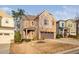 Charming two-story home with a stone and brick facade, complemented by a well-maintained lawn and attached garage at 2117 Mckenzie Ridge Lane Ln, Apex, NC 27502
