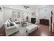 Bright living room featuring hardwood floors, fireplace, and large windows at 2117 Mckenzie Ridge Lane Ln, Apex, NC 27502