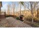 Backyard patio with pavers and a stone fireplace at 2117 Mckenzie Ridge Lane Ln, Apex, NC 27502