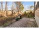 Backyard patio with pavers, fireplace, and view of a wooded area at 2117 Mckenzie Ridge Lane Ln, Apex, NC 27502
