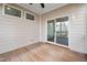 Screened-in porch with wood flooring and sliding glass door at 2117 Mckenzie Ridge Lane Ln, Apex, NC 27502
