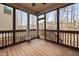 Spacious screened-in porch with wooden floors and view of the backyard at 2117 Mckenzie Ridge Lane Ln, Apex, NC 27502
