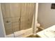 Well-lit bathroom features a standard tub, vanity and a coordinated color scheme at 2213 Oakhurst Trl, Hillsborough, NC 27278
