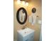 Updated bathroom with a modern vanity and decorative mirror at 2213 Oakhurst Trl, Hillsborough, NC 27278
