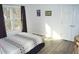 Bright bedroom with a view and modern flooring at 2213 Oakhurst Trl, Hillsborough, NC 27278