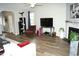 Spacious living room with fireplace, modern flooring, and ample natural light at 2213 Oakhurst Trl, Hillsborough, NC 27278