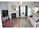 Bright living room features a fireplace, modern flooring, and a comfortable seating area at 2213 Oakhurst Trl, Hillsborough, NC 27278
