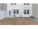 A small backyard with dead grass and a white privacy fence offers a private outdoor space at 236 Shingle Oak Rd, Wake Forest, NC 27587