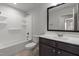 Well-lit bathroom featuring a bathtub, toilet, and vanity, designed for both functionality and comfort with a clean aesthetic at 236 Shingle Oak Rd, Wake Forest, NC 27587