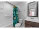 Well-lit bathroom featuring a bathtub, toilet, and vanity, designed for both functionality and comfort with a fun aesthetic at 236 Shingle Oak Rd, Wake Forest, NC 27587