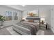 Bedroom with a large window, neutral decor, and a comfortable bed, creating a relaxing and stylish retreat at 236 Shingle Oak Rd, Wake Forest, NC 27587