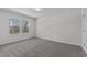 Bedroom with a bright window and neutral walls, providing a serene space filled with natural light and simple elegance at 236 Shingle Oak Rd, Wake Forest, NC 27587
