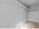 Walk-in closet features ample storage space with shelving, providing practical organization in a minimalist design at 236 Shingle Oak Rd, Wake Forest, NC 27587