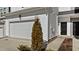 Charming townhome exterior featuring a one-car garage and well-maintained landscaping at 236 Shingle Oak Rd, Wake Forest, NC 27587