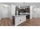 Kitchen featuring granite counters, stainless appliances, and wood flooring at 236 Shingle Oak Rd, Wake Forest, NC 27587