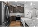 Kitchen featuring granite counters, stainless appliances, and wood flooring at 236 Shingle Oak Rd, Wake Forest, NC 27587