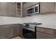 Kitchen featuring granite counters, stainless appliances, and tile backsplash at 236 Shingle Oak Rd, Wake Forest, NC 27587
