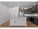 Kitchen featuring granite counters, stainless appliances, and wood flooring at 236 Shingle Oak Rd, Wake Forest, NC 27587